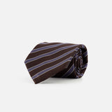 The ZEGNA Silk Jacquard Diagonal Stripes Neck Tie, featuring white and light blue stripes, is neatly rolled and displayed on a plain white background. Made in Italy.