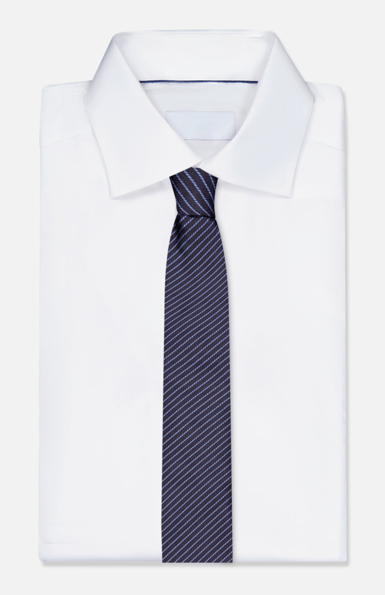 A ZEGNA Silk Jacquard Diagonal Stripes Neck Tie, made in Italy and featuring thin white stripes on navy, is paired with a classic white dress shirt—an elegant men's accessory set against a plain white background.