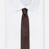 A neatly folded white dress shirt with a pointed collar, paired with the ZEGNA Silk Jacquard Tie in dark brown, made in Italy, displayed on a plain white background.