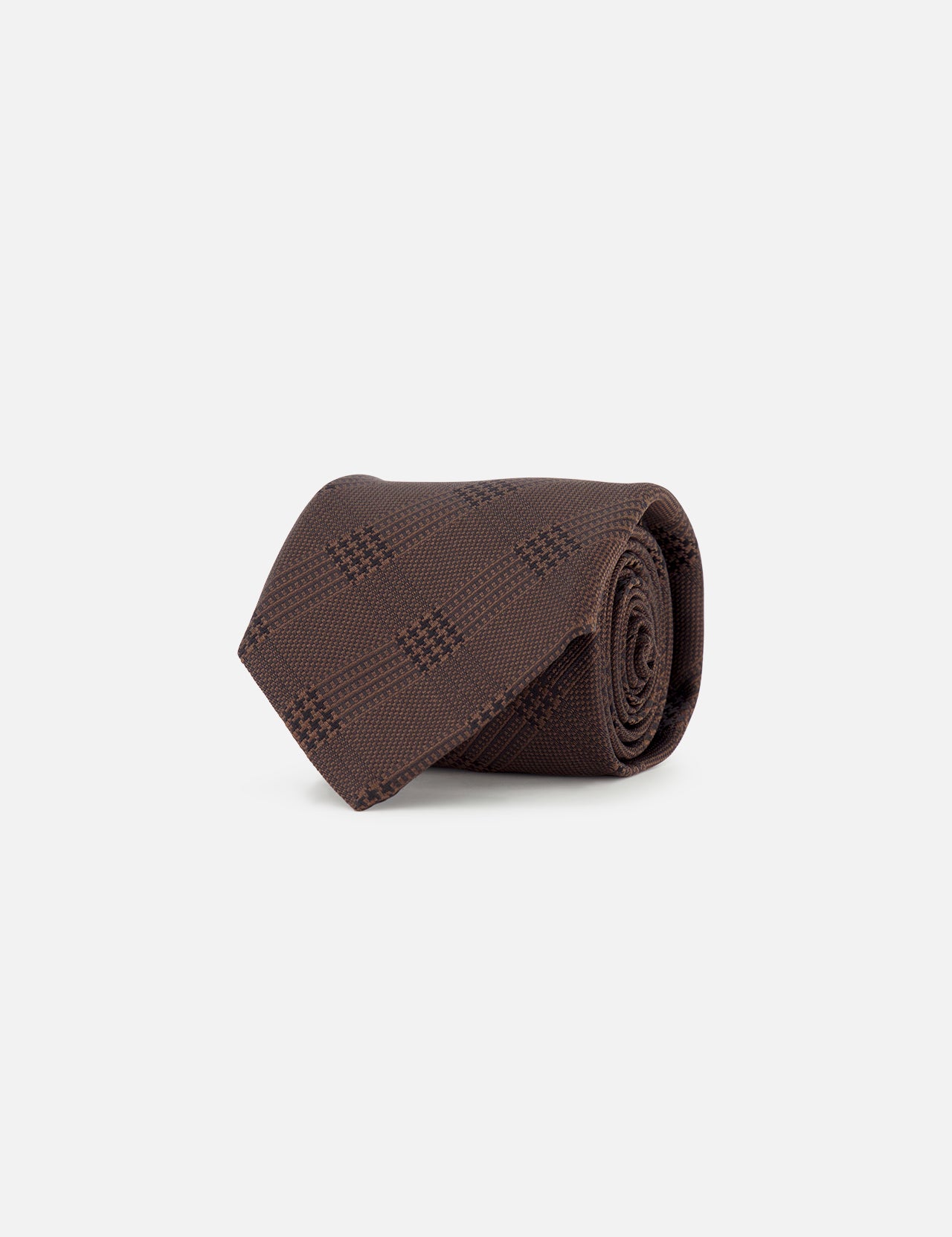 A rolled-up ZEGNA Silk Jacquard Tie in dark brown with a subtle checkered pattern, crafted in Italy, displayed on a plain white background.
