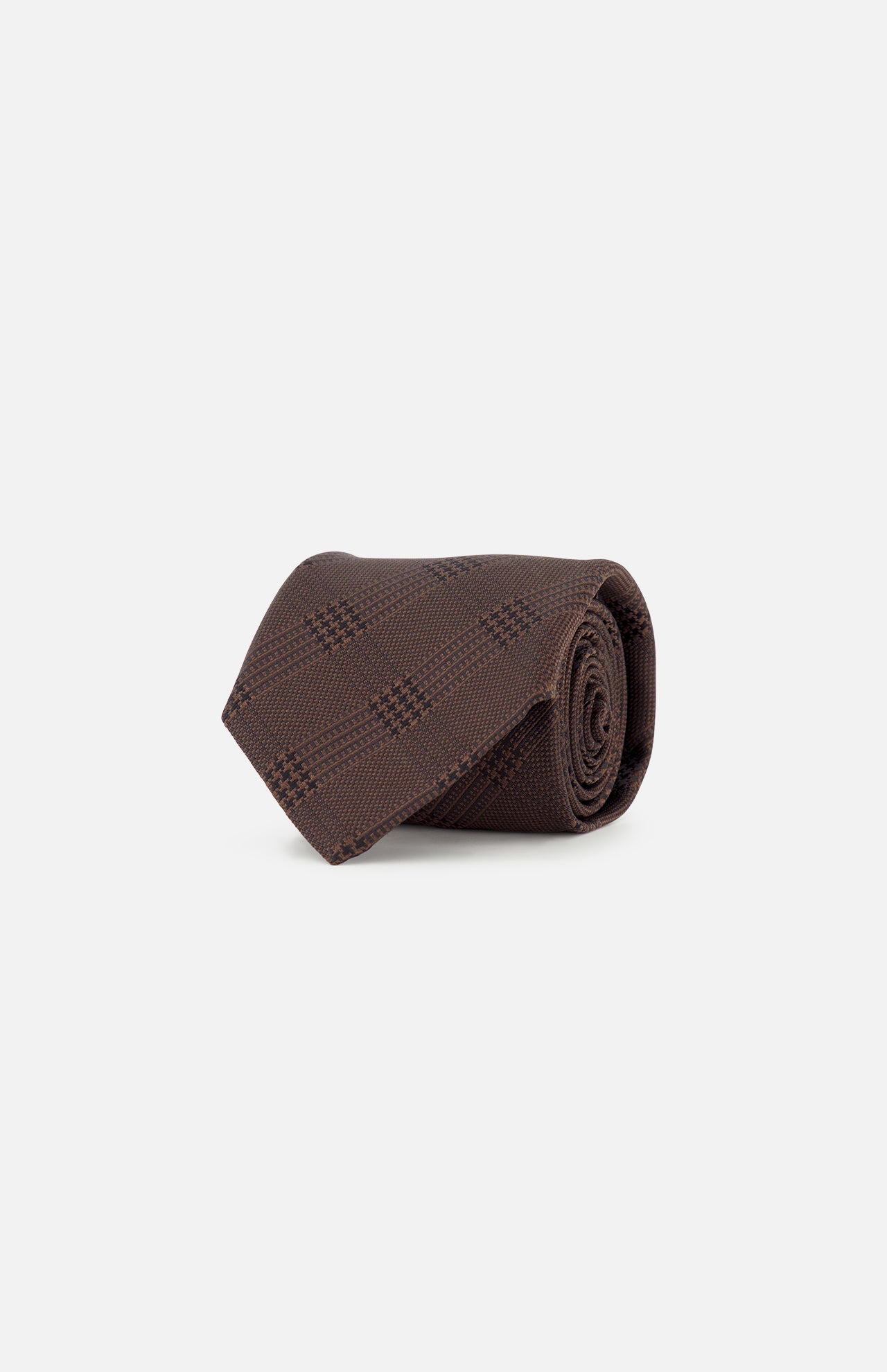 A rolled-up ZEGNA Silk Jacquard Tie in dark brown with a subtle checkered pattern, crafted in Italy, displayed on a plain white background.