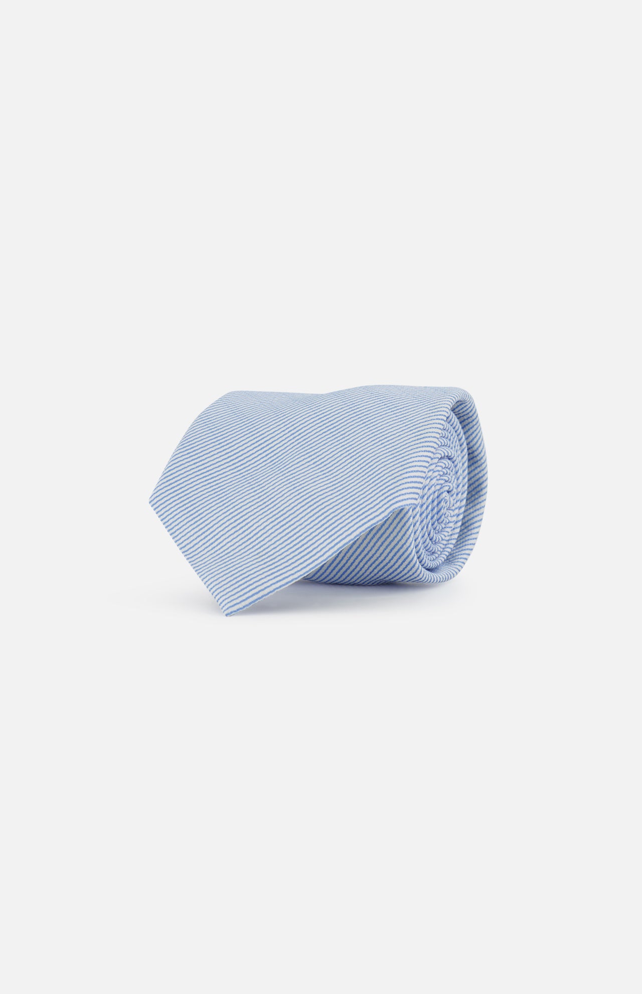 The ZEGNA Silk Jacquard Neck Tie, made in Italy, features a neatly rolled light blue silk with thin white diagonal stripes. Displayed on a plain white background, it's a timeless men's accessory for any occasion.