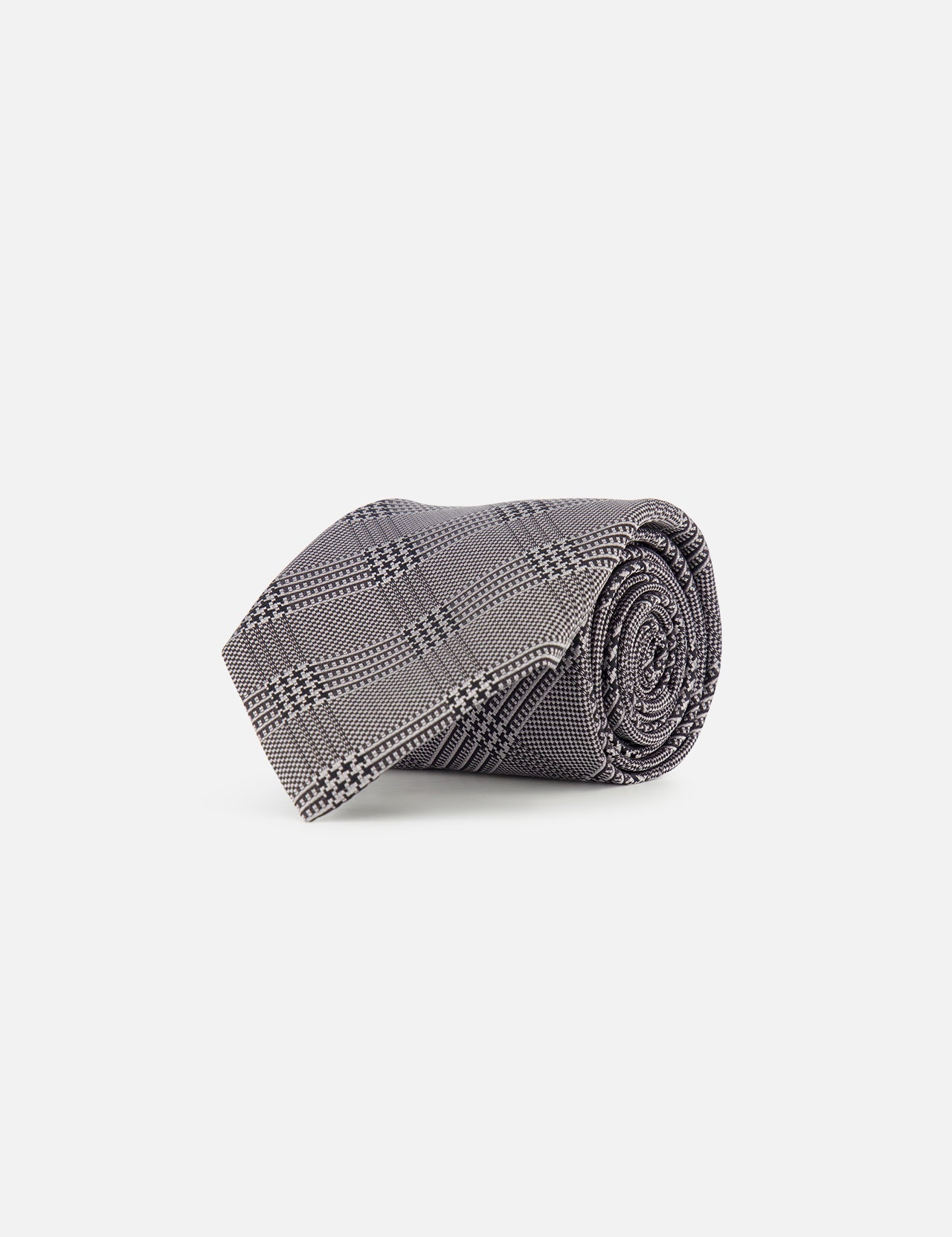 A ZEGNA Silk Jacquard Tie featuring a black and white plaid pattern in grey and black tones, expertly crafted in Italy, is showcased against a plain white background.