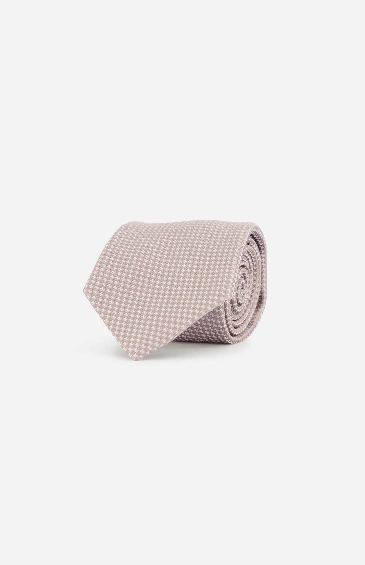 The ZEGNA Silk Jacquard Neck Tie, crafted in Italy, features a light pink hue with a small white houndstooth pattern and is shown neatly rolled on a plain white background.
