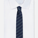 A neatly folded white dress shirt with a pointed collar is paired with the ZEGNA Silk Jacquard Tie, a navy accessory featuring diagonal light blue stripes, and displayed on a plain white background.
