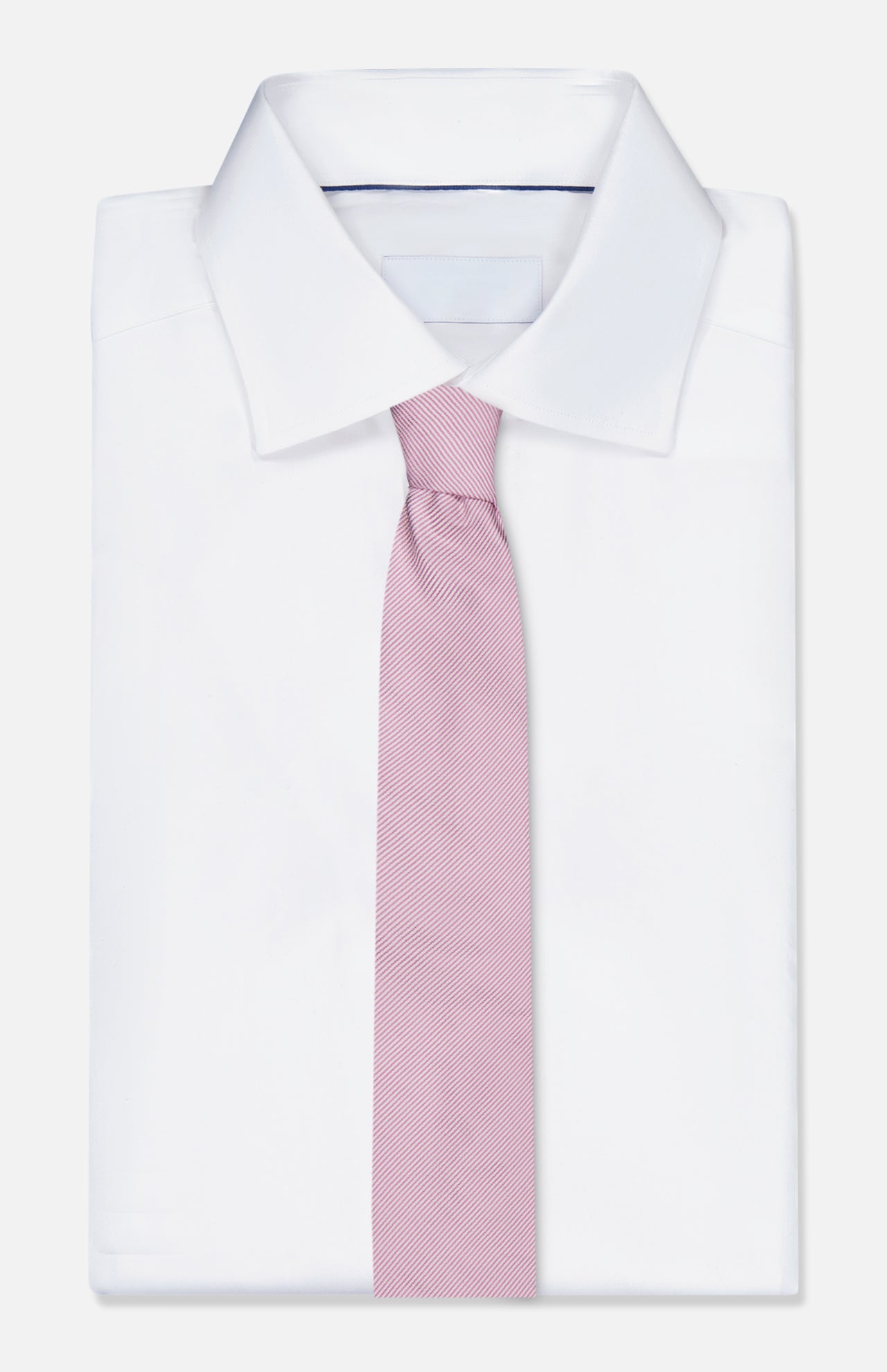 The ZEGNA Silk Jacquard Neck Tie in light pink is paired with a classic white dress shirt, neatly displayed against a plain white background—a sophisticated men’s accessory for any formal occasion.