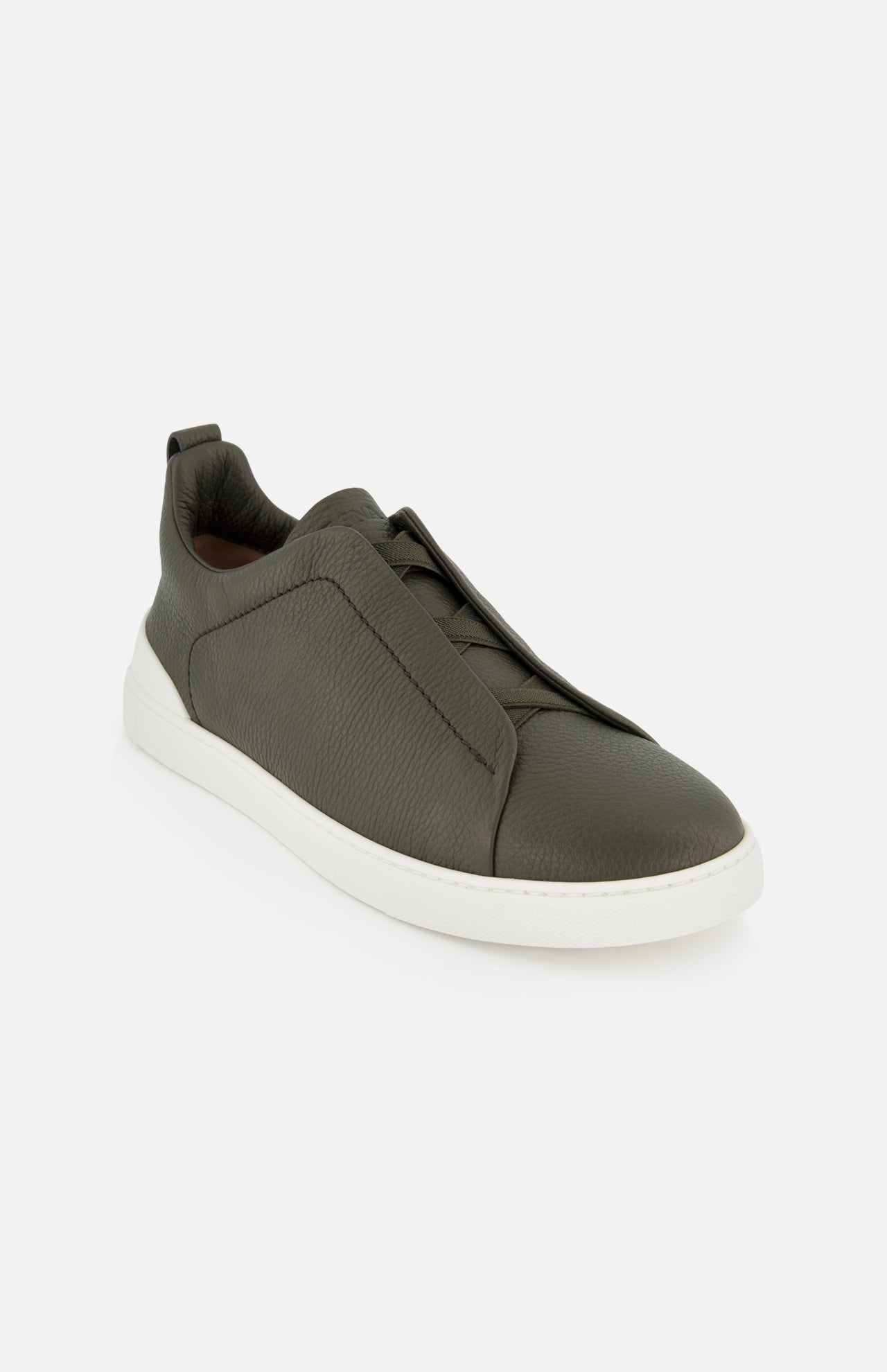 Olive green suede ZEGNA Triple Stitch Low Top Sneaker with a white rubber sole and signature elastic crossover detail on the tongue.