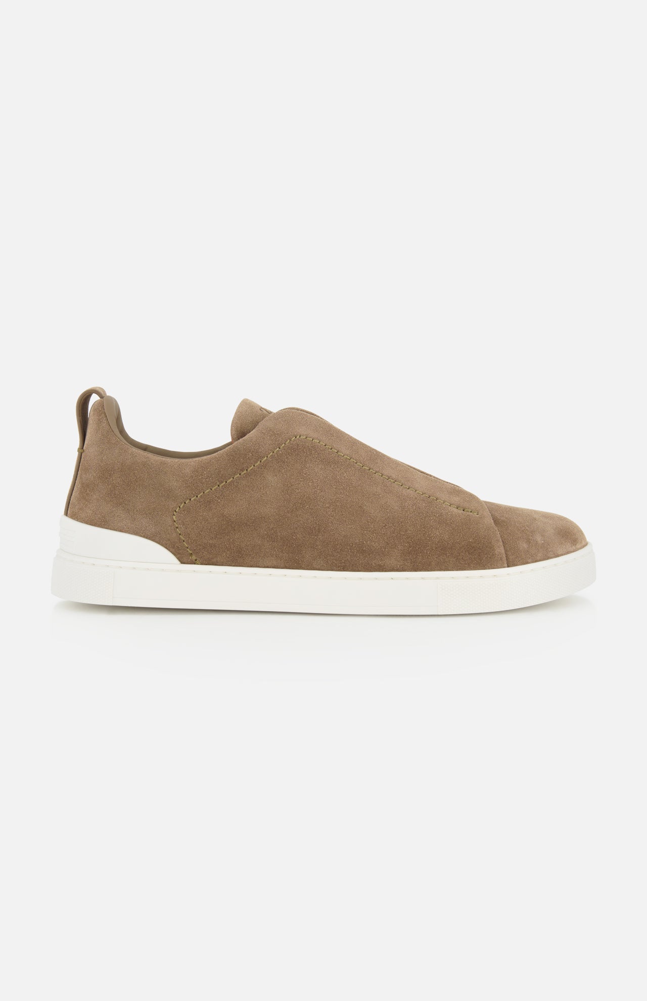 The ZEGNA Triple Stitch Low Top Sneaker, featuring brown suede uppers and a white rubber sole, is shown in a side view against a plain white background, exemplifying luxury casual footwear.