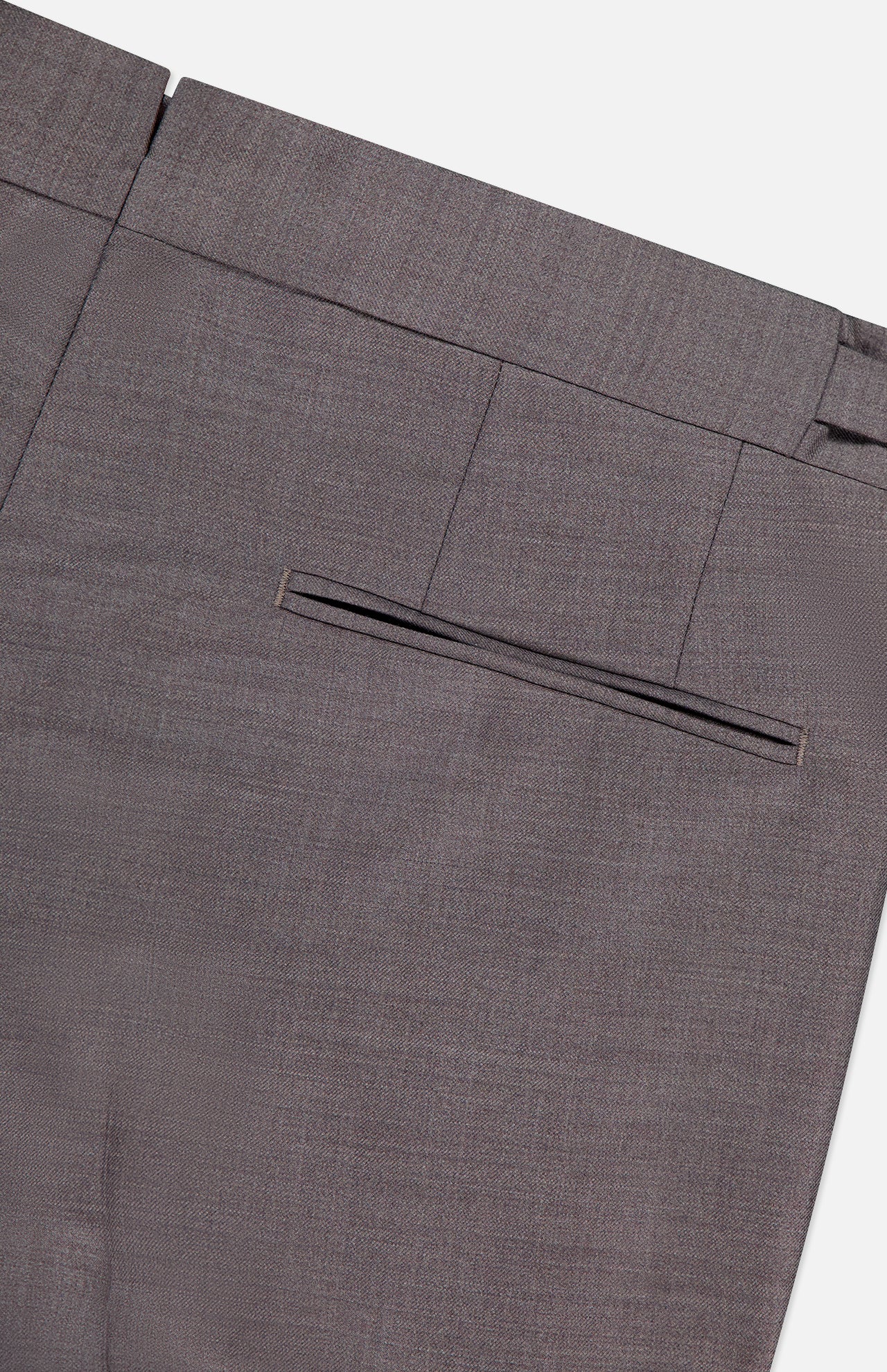 Close-up of ZEGNA Trofeo Wool Adjustable Tab Pants in brown slim fit, highlighting the waistband, belt loops, and single welt back pocket against a plain light background.