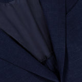 Close-up of the ZEGNA Trofeo Seersucker Suit Jacket in dark navy, featuring seersucker fabric, a single button, partial inner lining, and label inside the collar—a refined choice for any men's professional wardrobe.