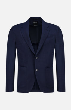 The ZEGNA Trofeo Seersucker Suit Jacket is a dark navy men's blazer featuring notch lapels, two front buttons, and two patch pockets—an essential for any professional wardrobe, shown on a plain white background.