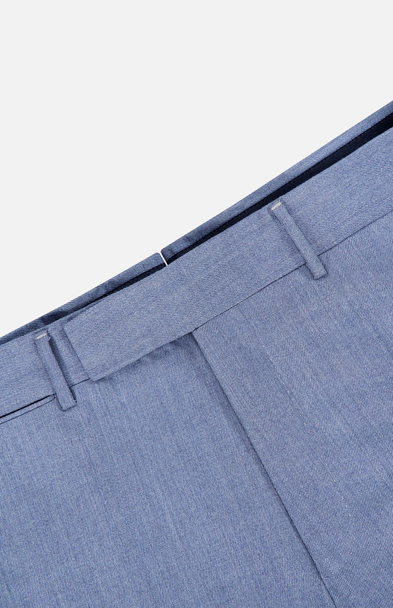 Close-up of the Trofeo Selection Trousers Pants by ZEGNA, featuring a slim fit in light blue crafted from luxurious ZEGNA wool, with emphasis on the waistband and belt loops against a light background.