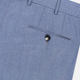 Detailed close-up of the Trofeo Selection Trousers Pants by ZEGNA, crafted from premium light blue wool. These slim fit trousers feature a single back pocket with a black button, belt loops, and neatly stitched seams, displayed against a white background.