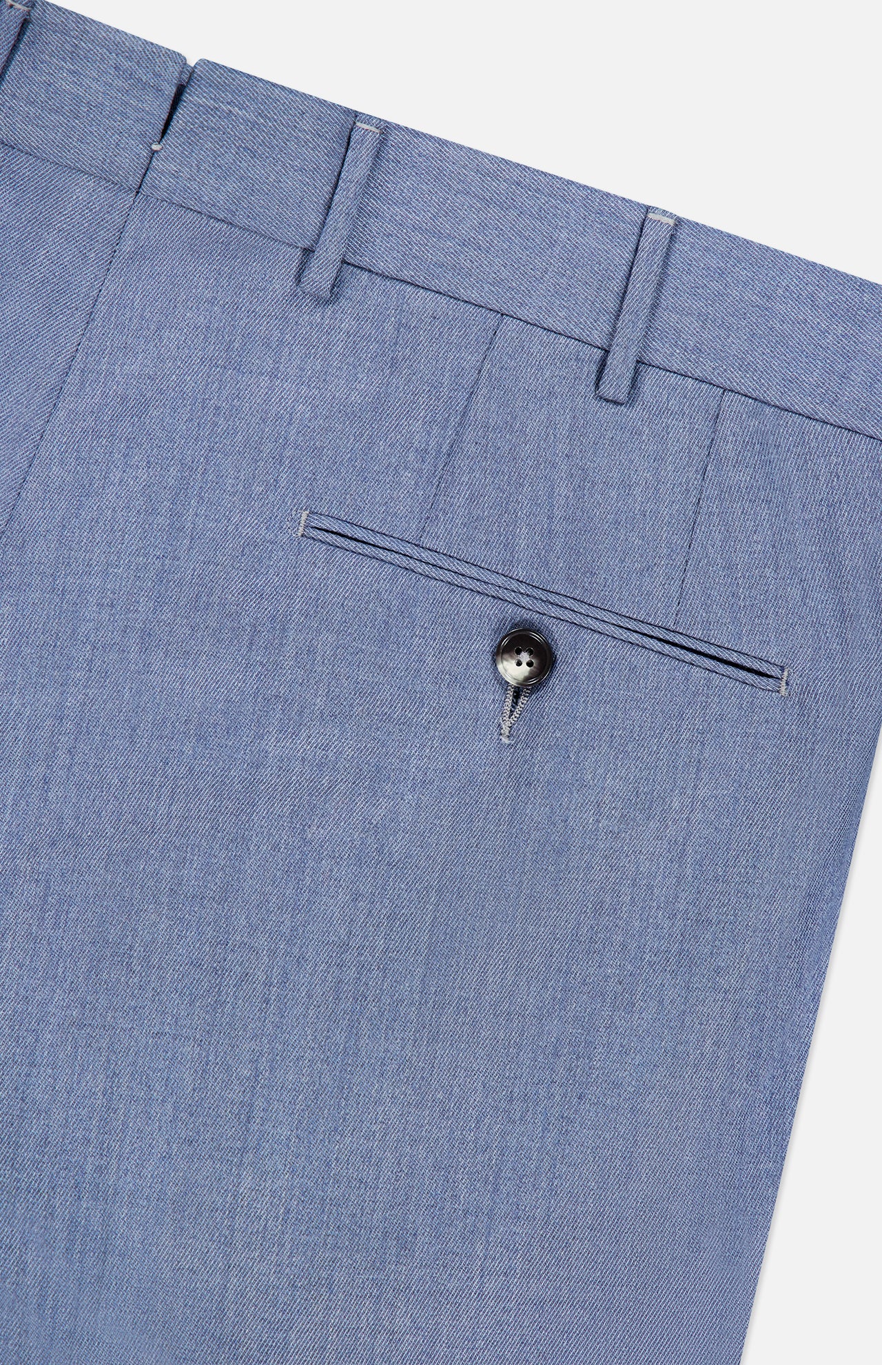 Detailed close-up of the Trofeo Selection Trousers Pants by ZEGNA, crafted from premium light blue wool. These slim fit trousers feature a single back pocket with a black button, belt loops, and neatly stitched seams, displayed against a white background.