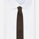 A neatly folded white dress shirt with a pointed collar is paired with the ZEGNA Wool Jacquard Tie, displayed against a plain white background.