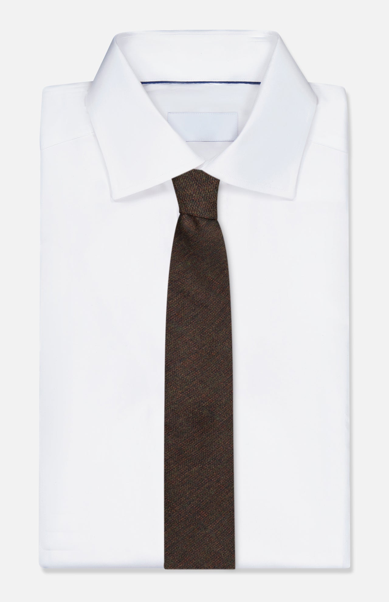 A neatly folded white dress shirt with a pointed collar is paired with the ZEGNA Wool Jacquard Tie, displayed against a plain white background.