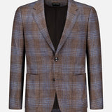 ZEGNA Wool Silk Linen Sportcoat in brown with a blue plaid pattern, crafted from a luxurious blend of wool, silk, and linen. Features include two buttons, notched lapels, two front flap pockets, and a chest pocket. Displayed against a plain white background.