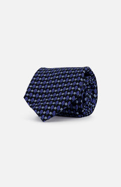 The ZEGNA Tree and Leaf Printed Silk Tie features a refined pattern, elegantly rolled on a white background. Made in Italy for timeless sophistication.