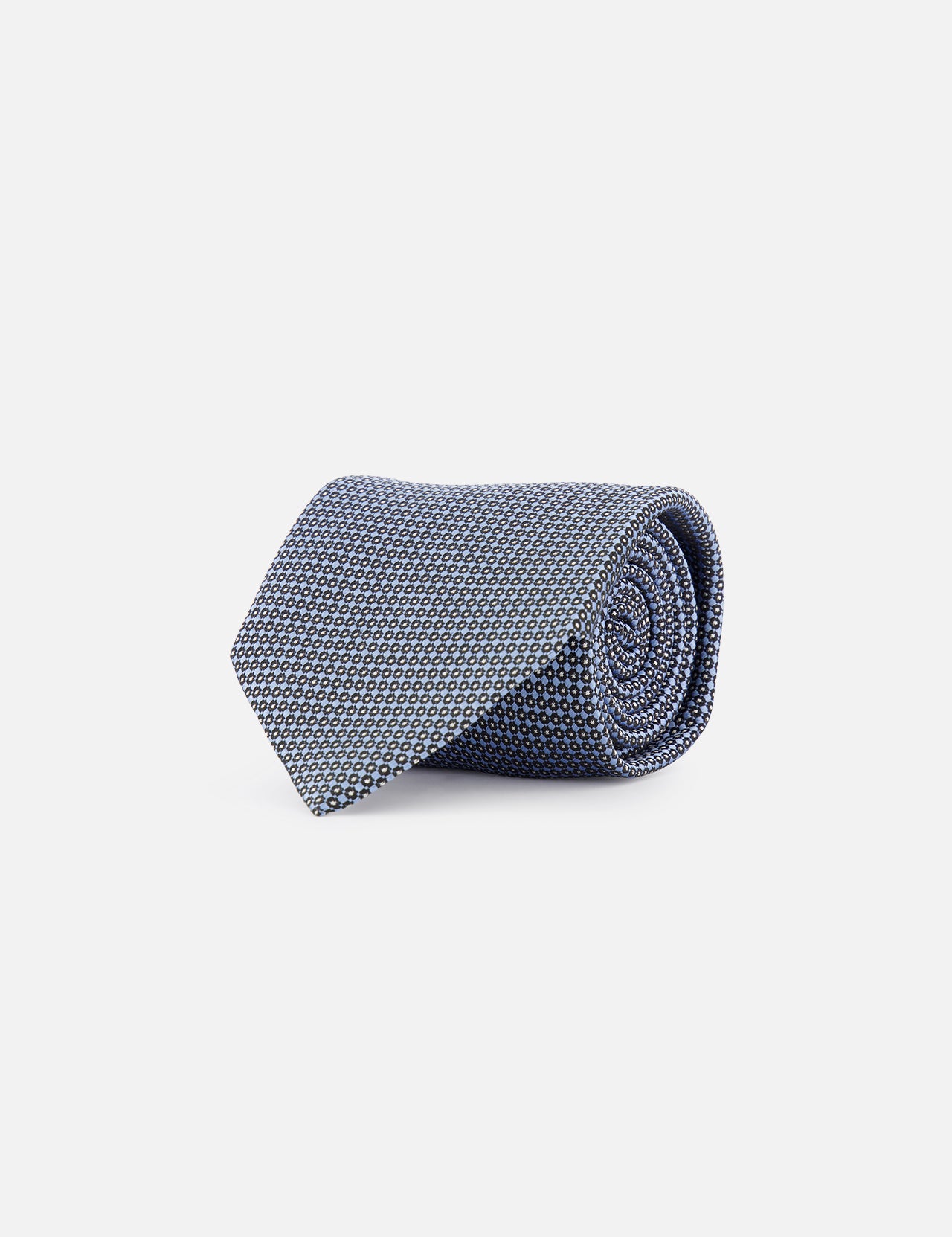 The ZEGNA Silk Jacquard Tie - Pure Blue is a luxury necktie with blue and white patterns, made in Italy and shown rolled up on a white background.
