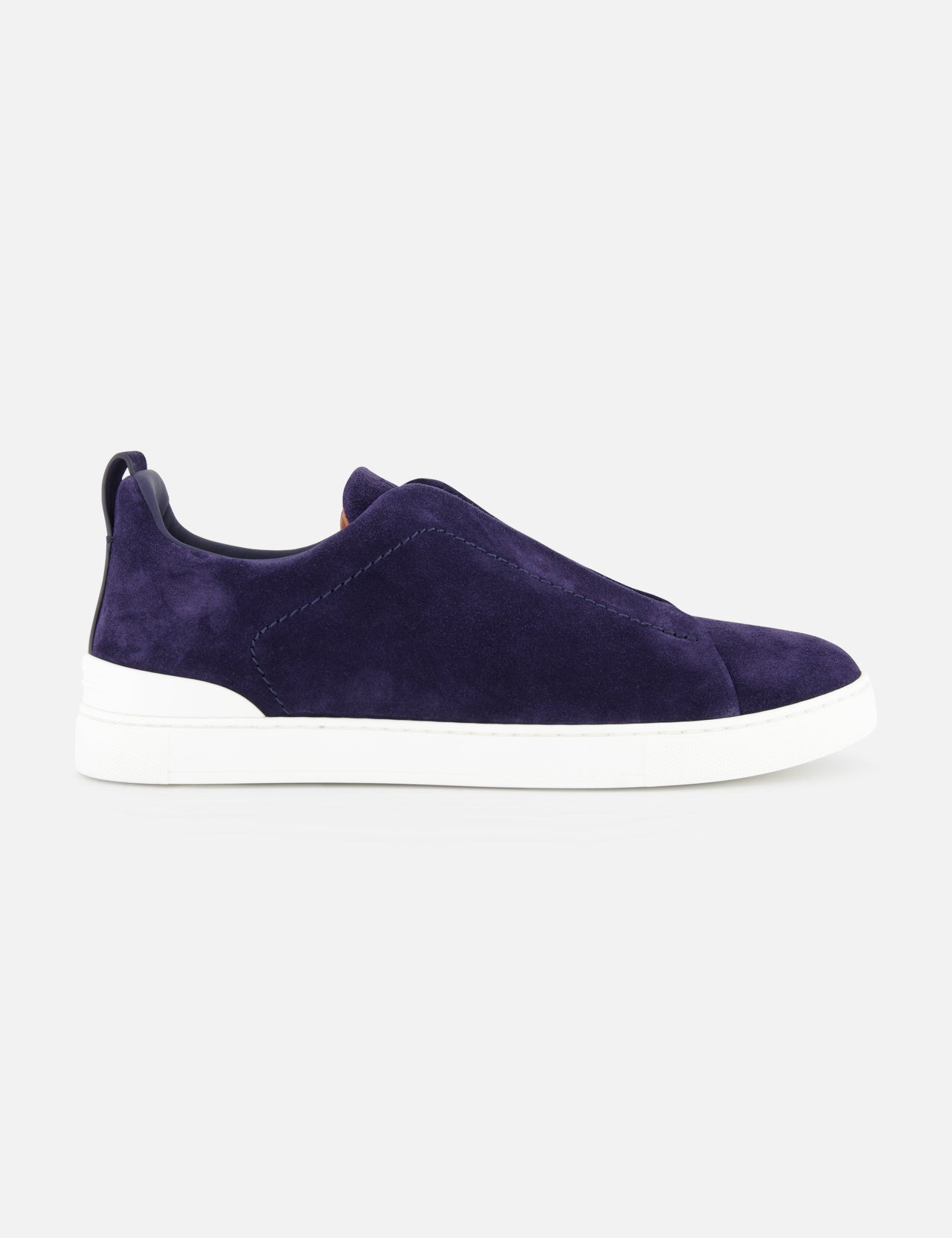 A side view of the ZEGNA Triple Stitch Low Top Suede Sneaker in dark purple with a white rubber sole, shown against a plain light gray background.