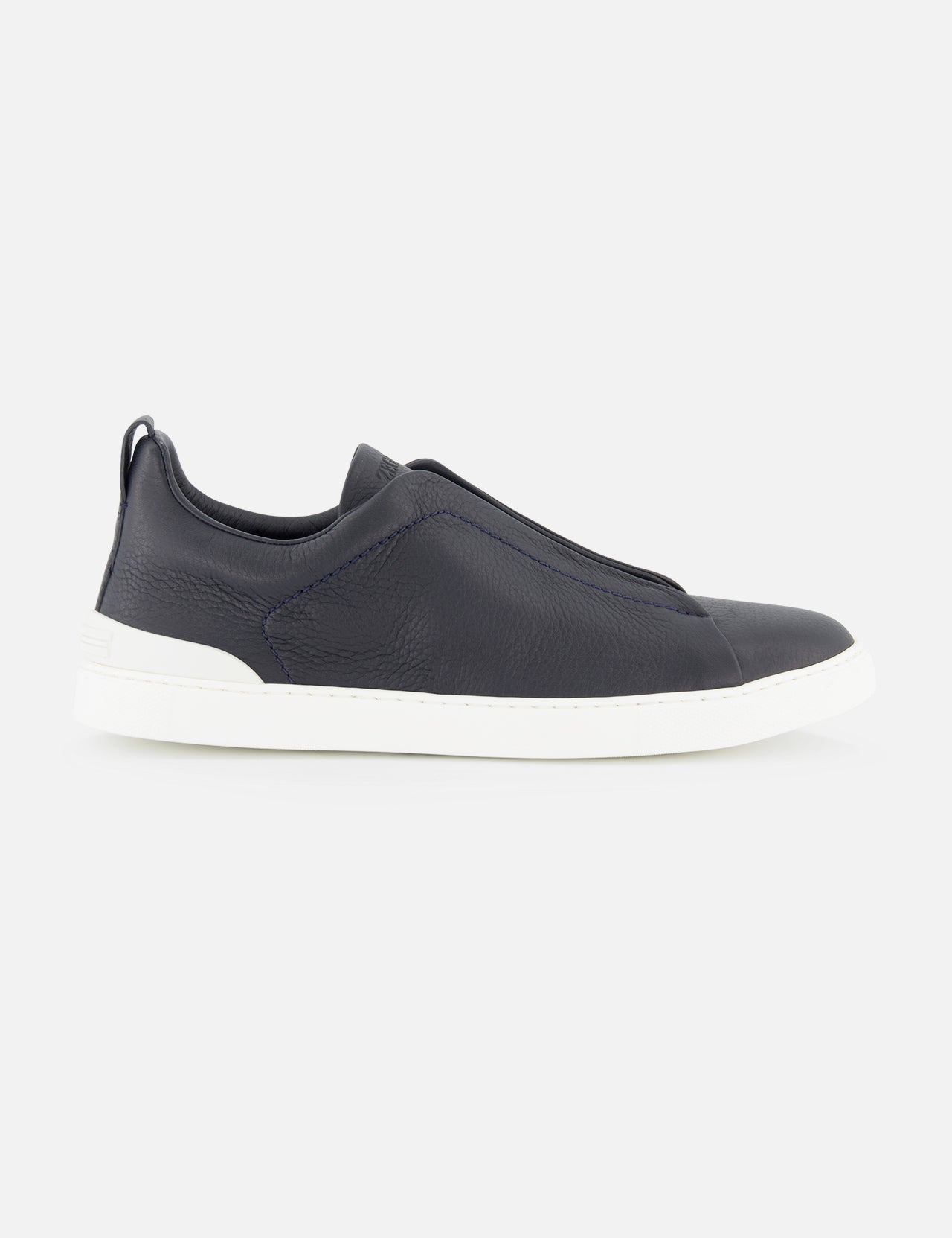 ZEGNA Triple Stitch Sneakers in navy blue smooth leather, featuring a laceless design and white rubber sole, photographed on a plain white background.