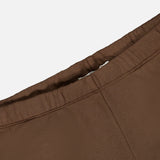 Close-up of the waistband and seam of the ETERNE Oversized Wide Leg Sweatpant in brown, highlighting the stitching and French Terry fabric texture against a plain white background.