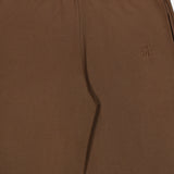 Close-up of ETERNE’s Oversized Wide Leg Sweatpant in brown, featuring an elastic waistband, side pocket, and a small stitched logo on the left. The soft French Terry material and wide-leg design offer a comfortable feel and relaxed fit.