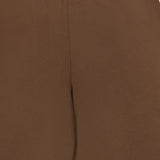 Close-up of the back of the ETERNE Oversized Wide Leg Sweatpant in brown, highlighting the waistband and seam details. The fabric is smooth and slightly stretchy, crafted from soft French Terry material, with a minimalist design featuring no visible pockets or embellishments.