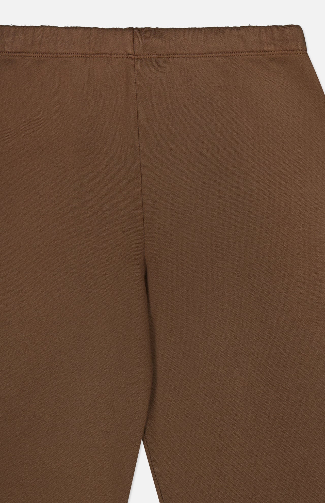 Close-up of the back of the ETERNE Oversized Wide Leg Sweatpant in brown, highlighting the waistband and seam details. The fabric is smooth and slightly stretchy, crafted from soft French Terry material, with a minimalist design featuring no visible pockets or embellishments.