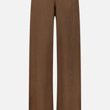 The ETERNE Oversized Wide Leg Sweatpant, featuring a brown French terry fabric, elastic waistband, and a subtle logo on the upper left side, is displayed against a plain white background.