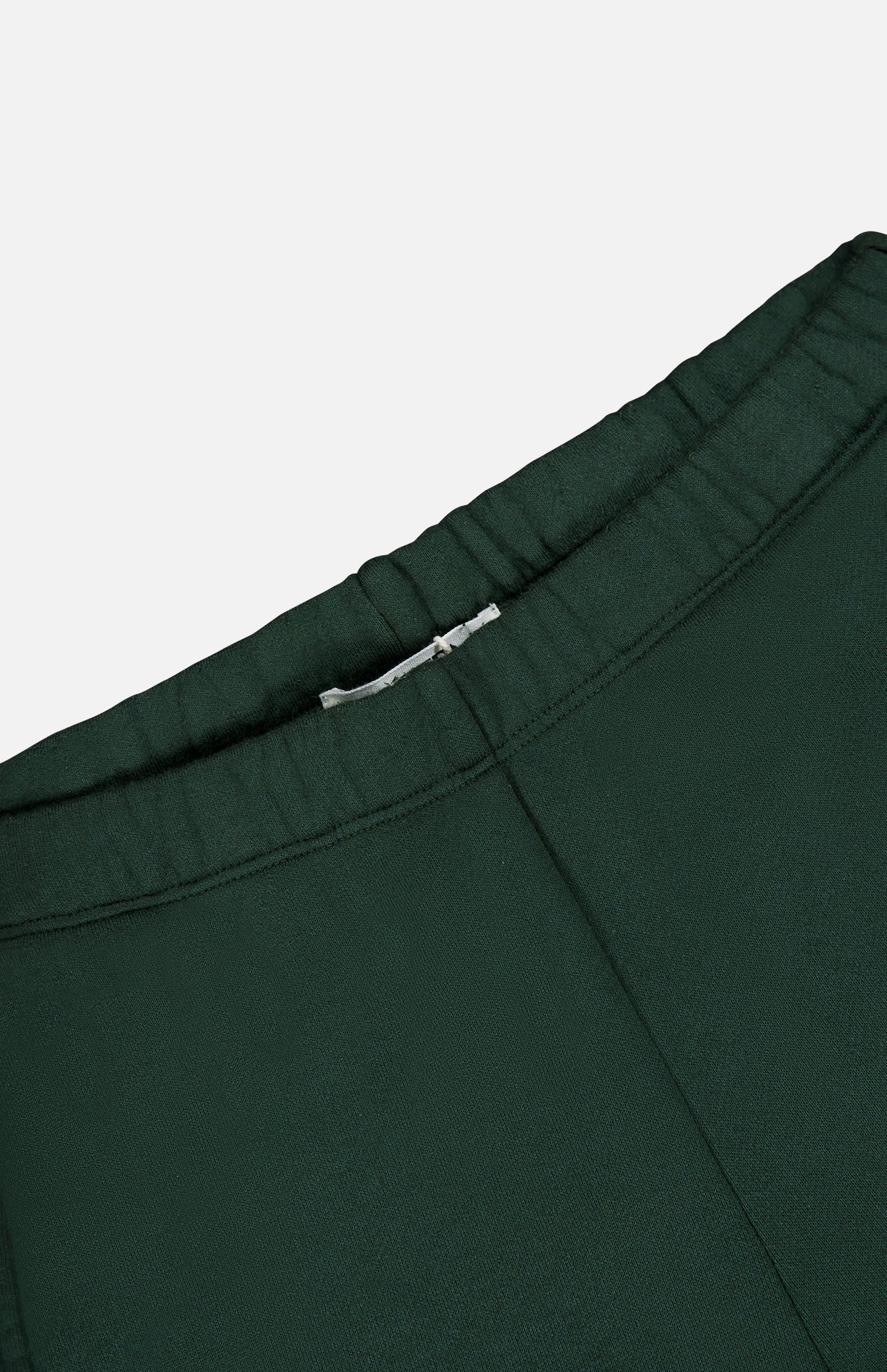 Close-up of the elasticized waistband on dark green French terry Oversized Wide Leg Sweatpant.