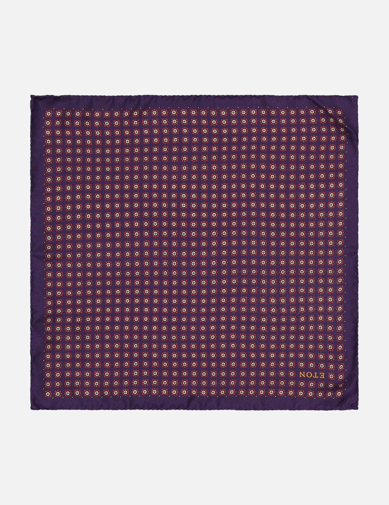 The ETON Geometric Silk Pocket Square is a purple Italian accessory featuring a geometric print of small orange and yellow circles and "NO.33" in the bottom right corner.