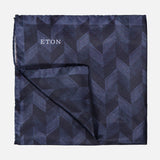 A sophisticated men's accessory, the ETON Chevron Silk Twill Pocket Square in navy blue showcases a refined chevron pattern and is elegantly displayed against a plain light background.