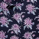 Close-up of the ETON Floral Print Twill Contemporary Dress Shirt in dark navy, showcasing a multicolored floral print with large lavender and purple chrysanthemums, greenish-gray leaves, black buttons, and a visible collar with the ETON label.