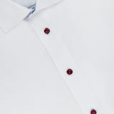 A close-up of the ETON Geometric Effect Twill Contemporary Dress Shirt in white, featuring a spread collar, three maroon buttons, subtle patterned collar lining, and wrinkle-resistant fabric for all-day crispness.
