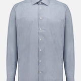 The ETON Geometric Signature Twill Dress Shirt features a light blue slim fit, subtle small dot pattern, wrinkle-resistant fabric, white buttons, pointed collar, and buttoned cuffs, shown on a plain white background.