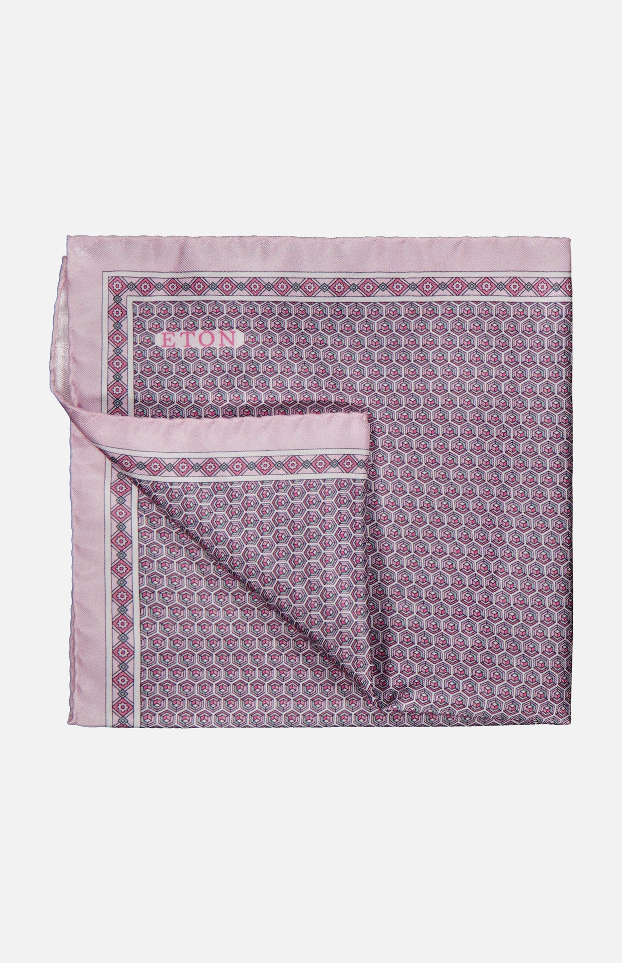 Introducing the ETON Geometric Silk Twill Pocket Square—a folded pink silk accessory adorned with an intricate geometric pattern in purple and blue, complete with a solid pink border and a subtly turned-up corner revealing the reverse side of the fabric. This elegant luxury piece is perfect for elevating sophisticated ensembles.