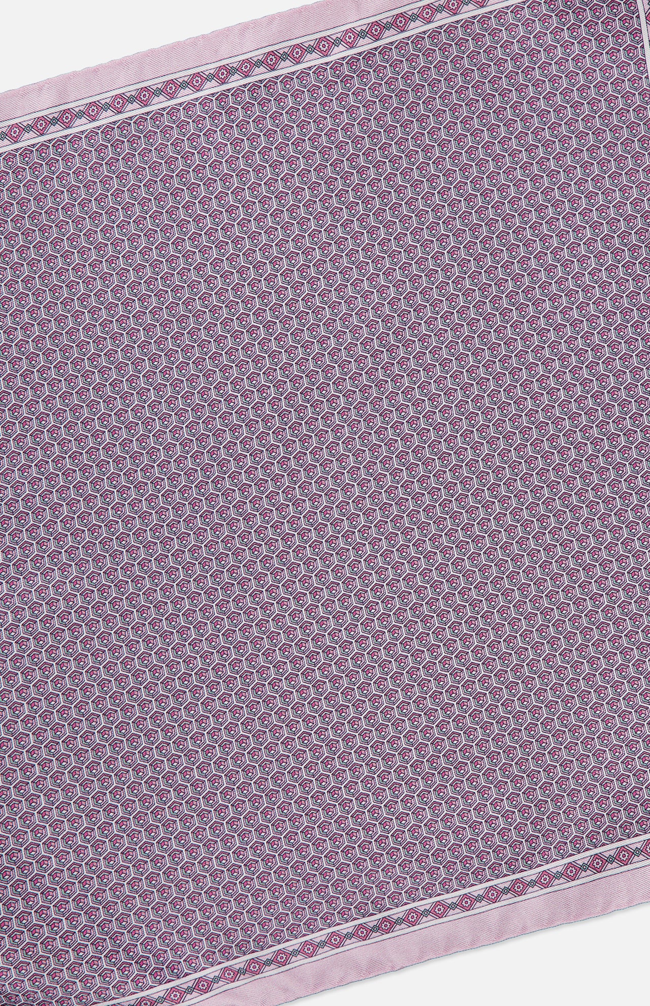 Introducing the Geometric Silk Twill Pocket Square by ETON: crafted from fine silk and featuring a small, repeating circular pattern in purple and white, this elegant accessory is framed by a lavender border with a sophisticated geometric motif. Displayed at a diagonal angle, this pocket square adds a touch of luxury to any refined ensemble.