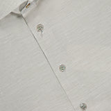 Close-up of ETON's Semi Solid Cotton Linen Dress Shirt in light gray. Features a textured slim-fit design, spread collar, and three visible buttons. The shirt label is in the top left—ideal for formal occasions.