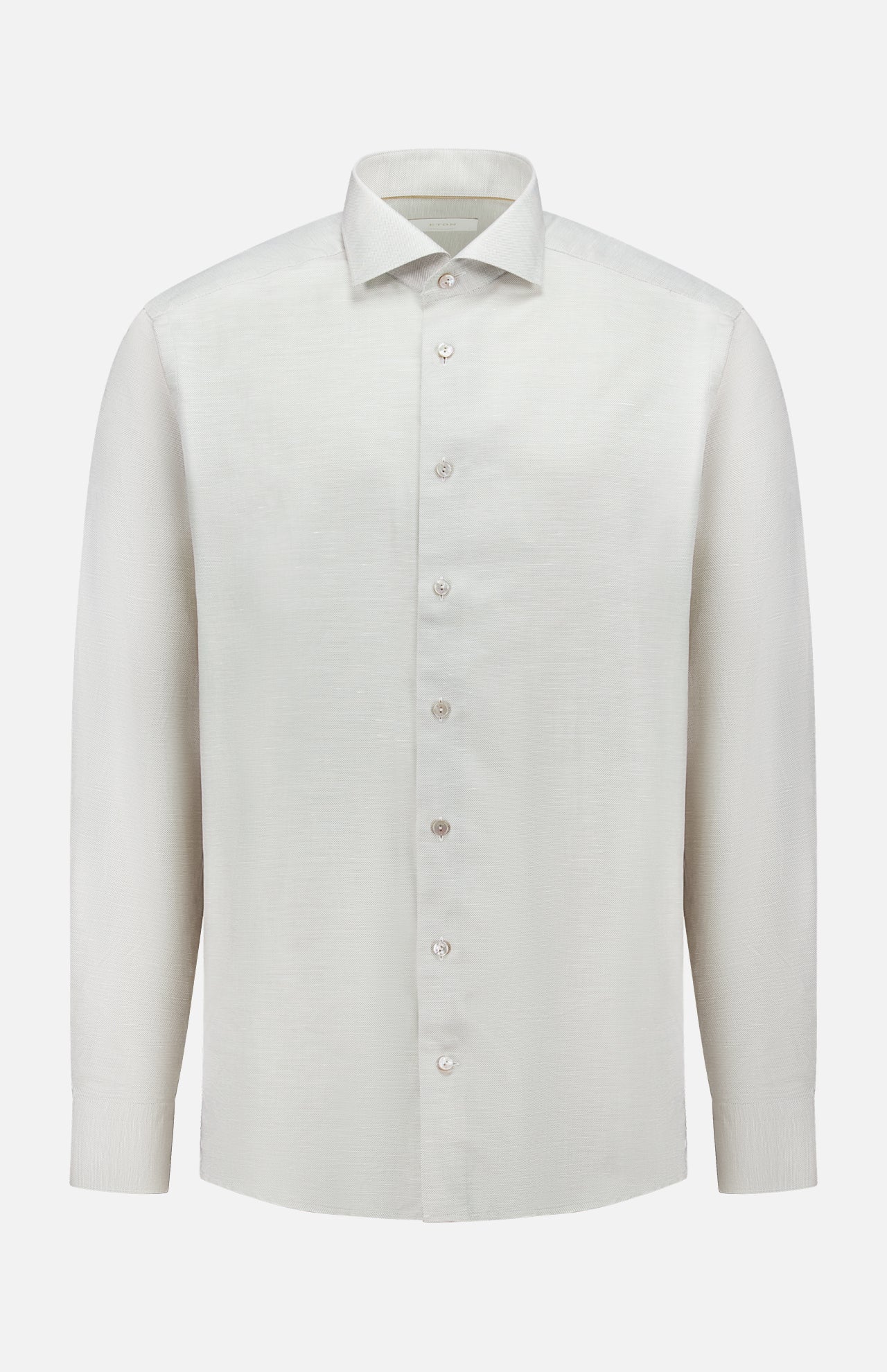 The ETON Semi Solid Cotton Linen Dress Shirt features long sleeves, a classic collar, and a plain white design—ideal for formal occasions and pictured against a white background.