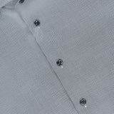 Close-up of the ETON Semi Solid Dobby Contemporary Dress Shirt with black buttons and a visible collar label. The wrinkle-resistant fabric displays a small geometric pattern in white and dark gray.