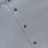 Close-up of the ETON Semi Solid Dobby Slim Dress Shirt in gray with a subtle geometric pattern, dark buttons, and a visible ETON CONTEMPORARY label inside the collar.