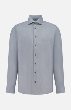The ETON Semi Solid Dobby Slim Dress Shirt features a light gray, long-sleeve design with a classic collar, buttoned cuffs, and smooth, subtly textured fabric, shown against a plain white background.
