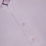 Close-up of ETON's Semi Solid Signature Twill Dress Shirt in light pink, featuring a slim fit, classic collar, white buttons, and a smooth texture. The inside collar displays the ETON label.