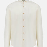 The ETON Solid Flannel Shirt is a long-sleeved, off-white cotton flannel shirt with a classic collar, designed for casual comfort and crafted from premium fabric sourced from the renowned Italian mill Canclini. Shown on a plain white background.
