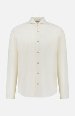 The ETON Solid Flannel Shirt is a long-sleeved, off-white cotton flannel shirt with a classic collar, designed for casual comfort and crafted from premium fabric sourced from the renowned Italian mill Canclini. Shown on a plain white background.