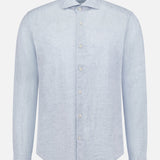 The ETON Solid Linen Dress Shirt in light blue features long sleeves, a classic collar, and white buttons, shown on a plain white background.