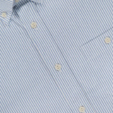 Close-up of ETON’s Striped Cotton Oxford Shirt, featuring light blue stripes, white buttons, and a visible chest pocket. Made from high-quality cotton, the shirt has an inner collar label displaying the ETON brand.