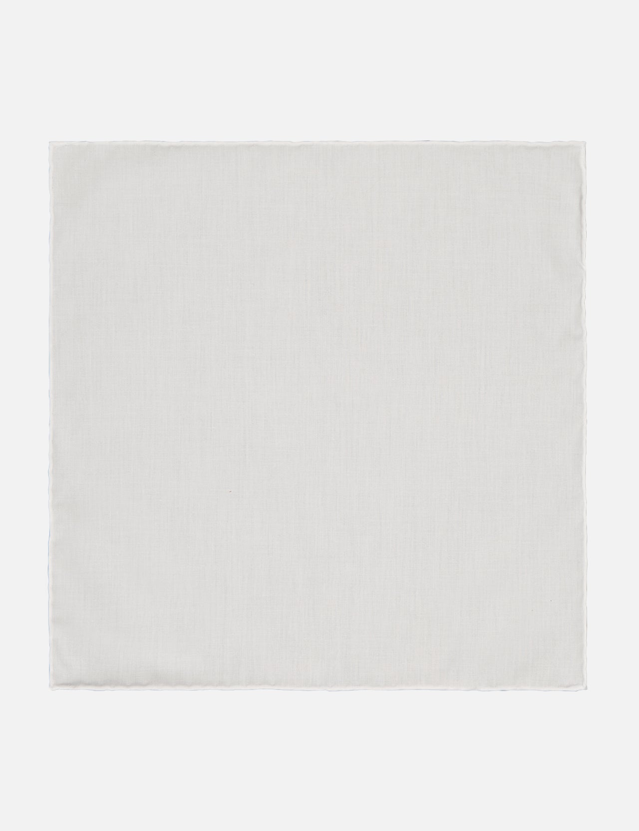 The Signature Twill Pocket Square White by ETON features a crisp, elegant design reminiscent of a formal accessory, with its plain, rectangular shape and light color set against a white background.