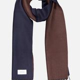 The ETON Two-Sided Merino Wool Scarf features navy blue on one side and brown on the other, finished with fringed ends and a white ETON label, crafted in Italy and presented on a light background.